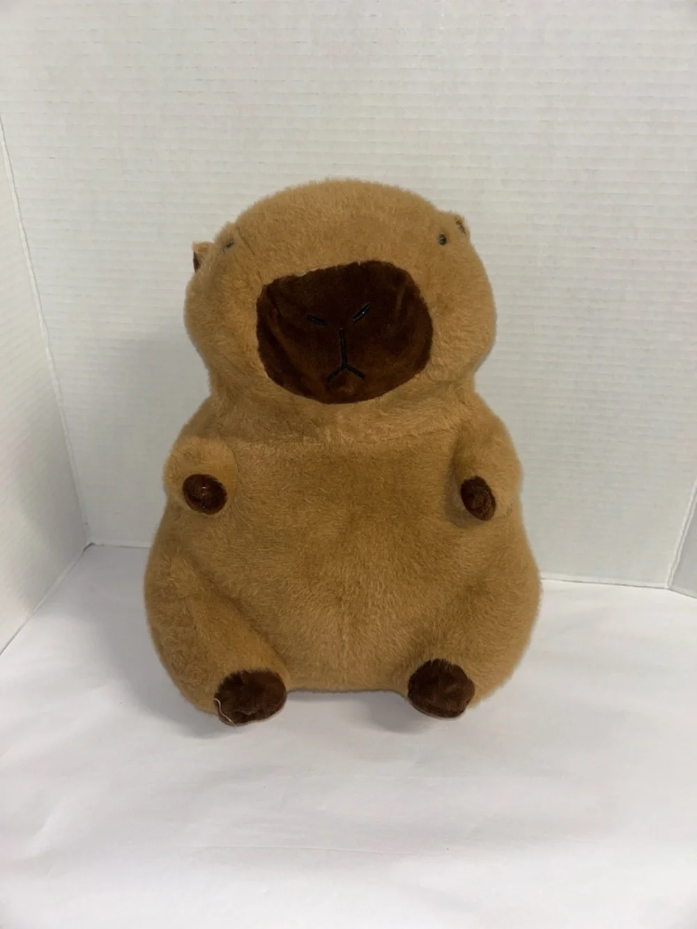 Plush Brown Capybara Pet Toy with Orange-and-White Donut Collar